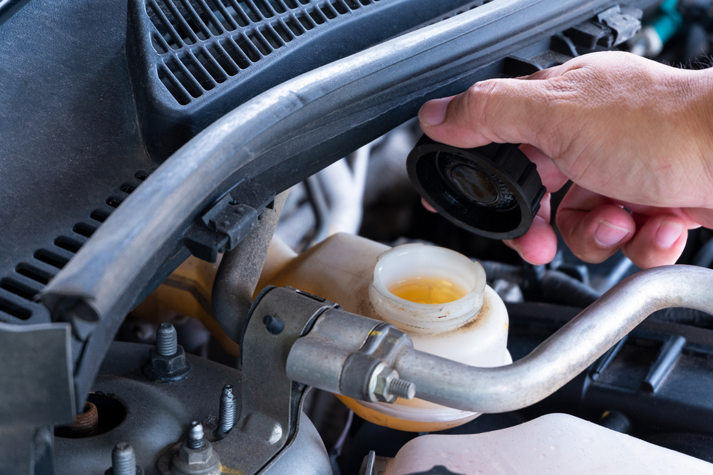 car Inspecting Brake Components